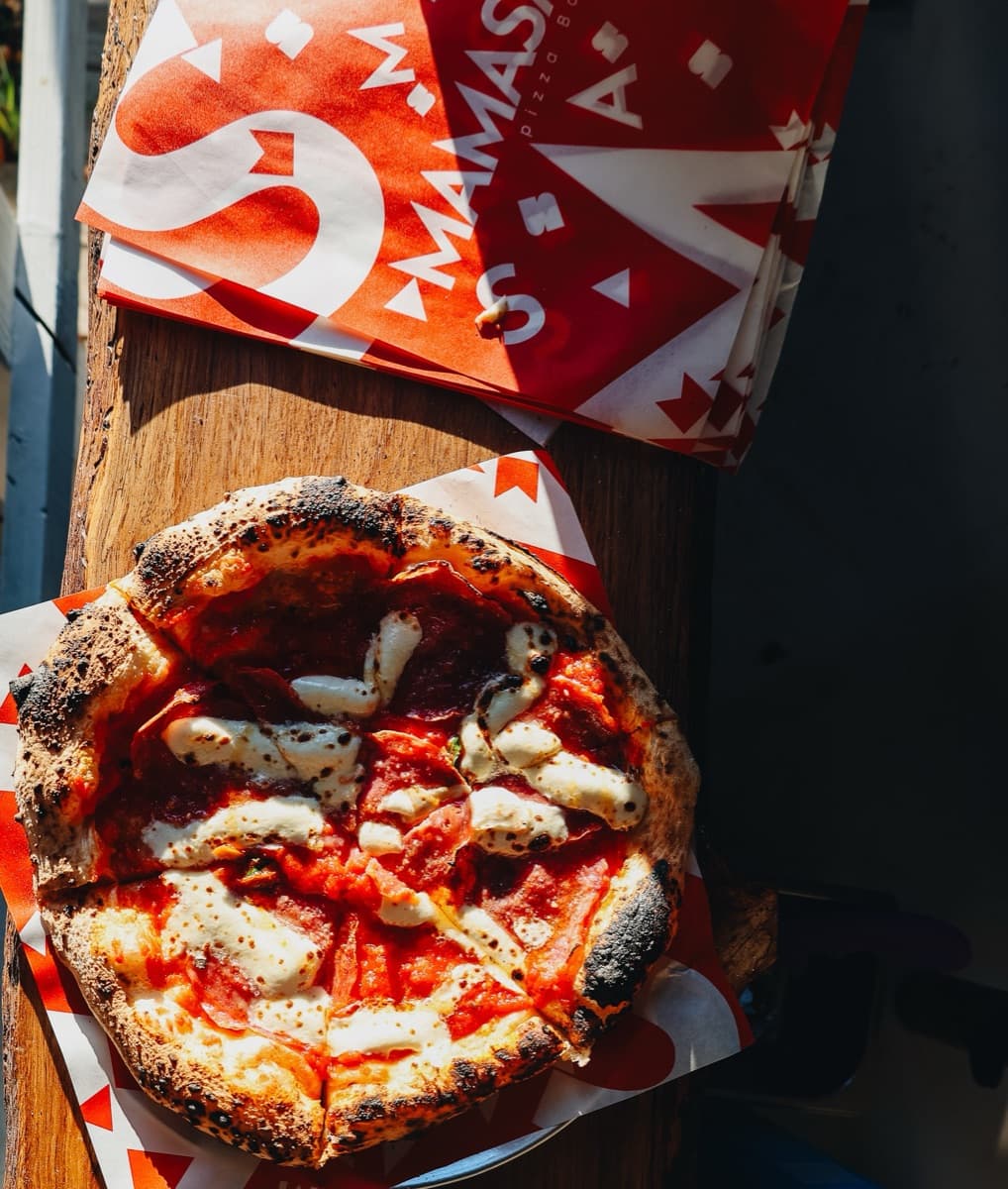 Wood-fired Mamasamas pizza with branded box